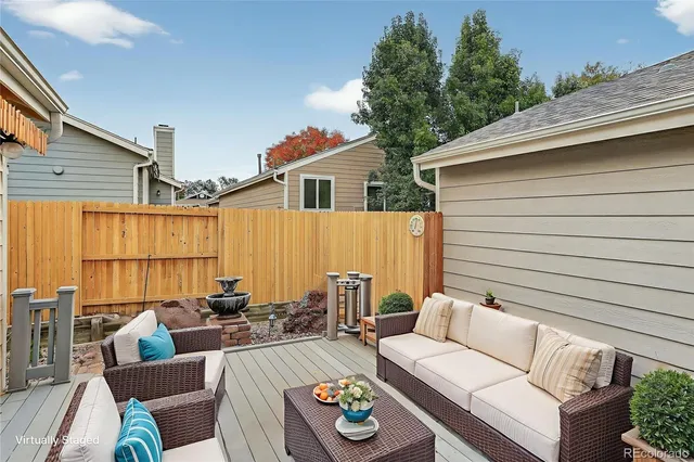 a view of a backyard with sitting area