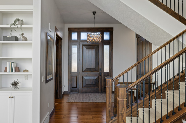 707 Chimney Rock Road, Unit 247 Heber City, UT 84032 - Photo 17 of 64 Entryway featuring dark wood finished floors and a chandelier