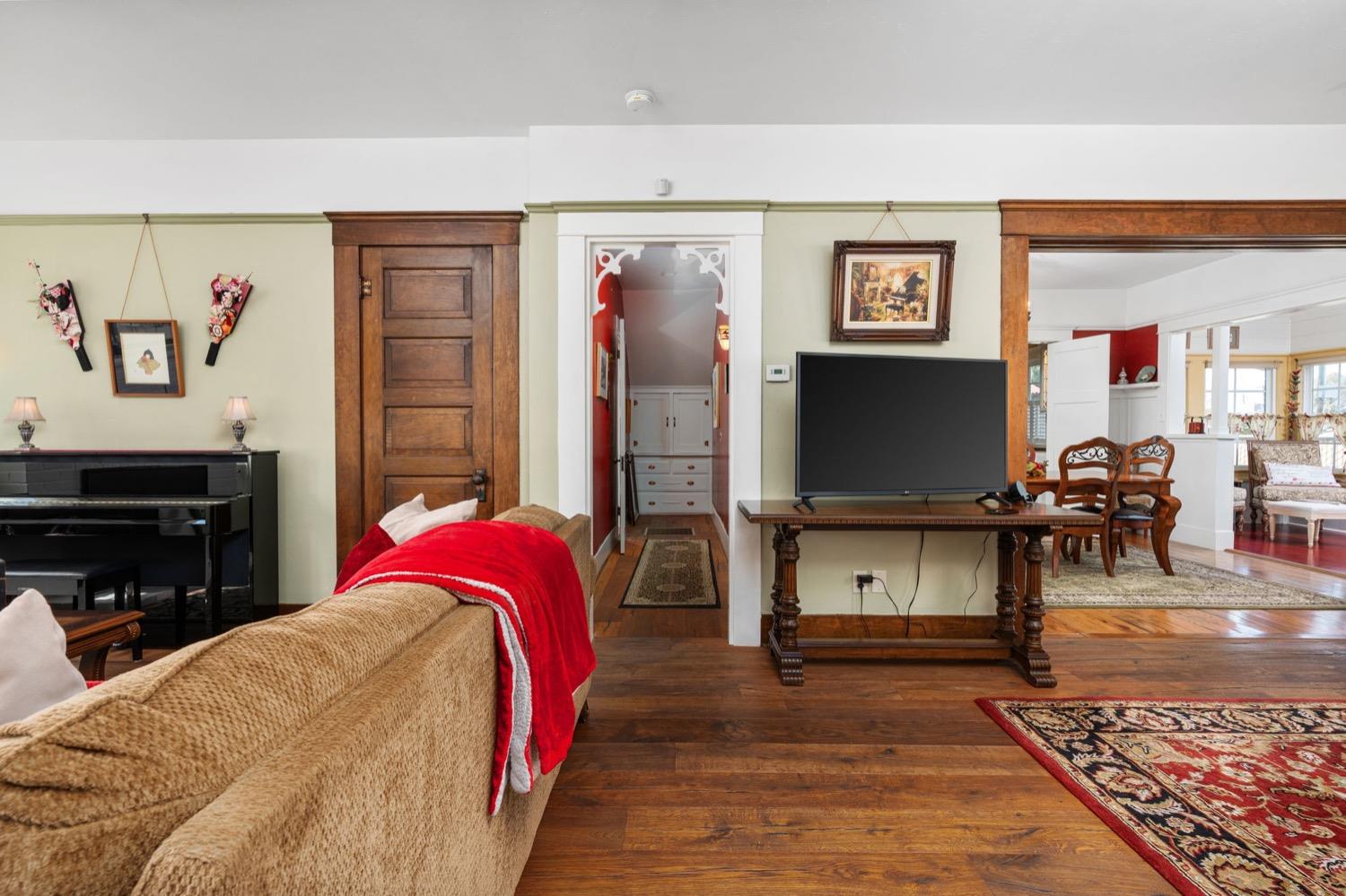 406 Oxford Avenue Clovis, CA 93612 - Photo 19 of 89 a living room with furniture a flat screen tv and a fireplace