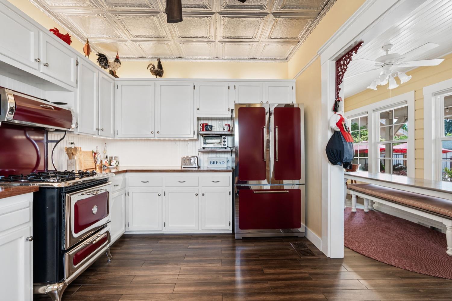 406 Oxford Avenue Clovis, CA 93612 - Photo 33 of 89 a kitchen with stainless steel appliances granite countertop a refrigerator and wooden cabinets