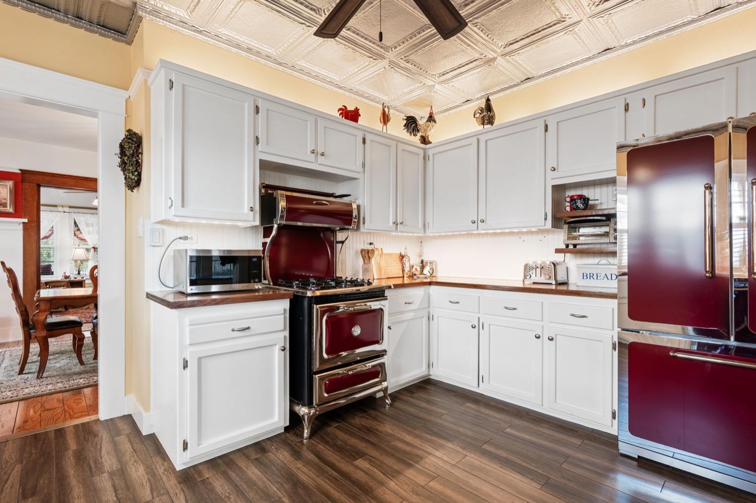 406 Oxford Avenue Clovis, CA 93612 - Photo 36 of 89 a kitchen with stainless steel appliances granite countertop a refrigerator a stove top oven a sink and dishwasher