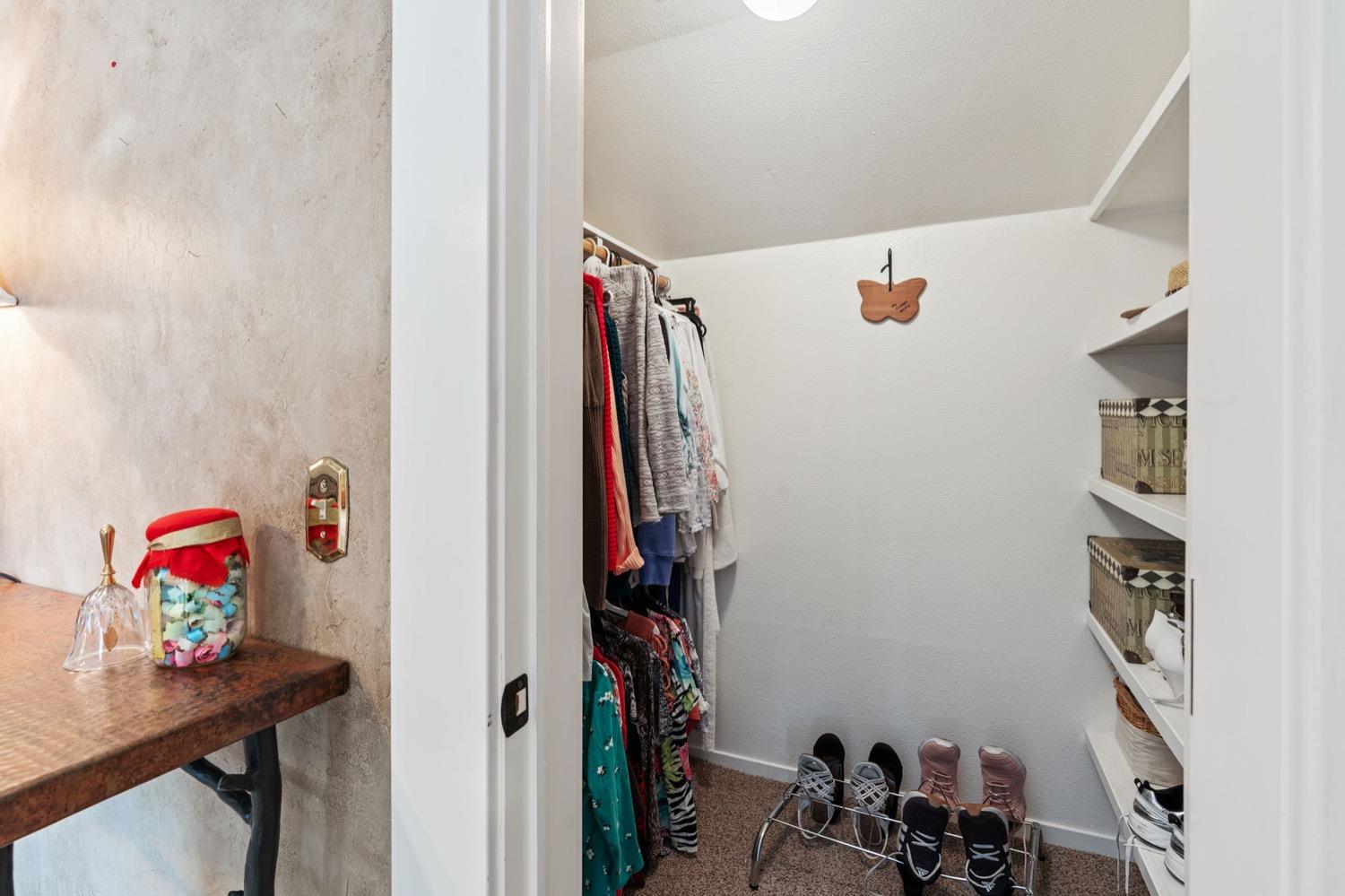 406 Oxford Avenue Clovis, CA 93612 - Photo 58 of 89 a view of walk in closet with clothes and shoes