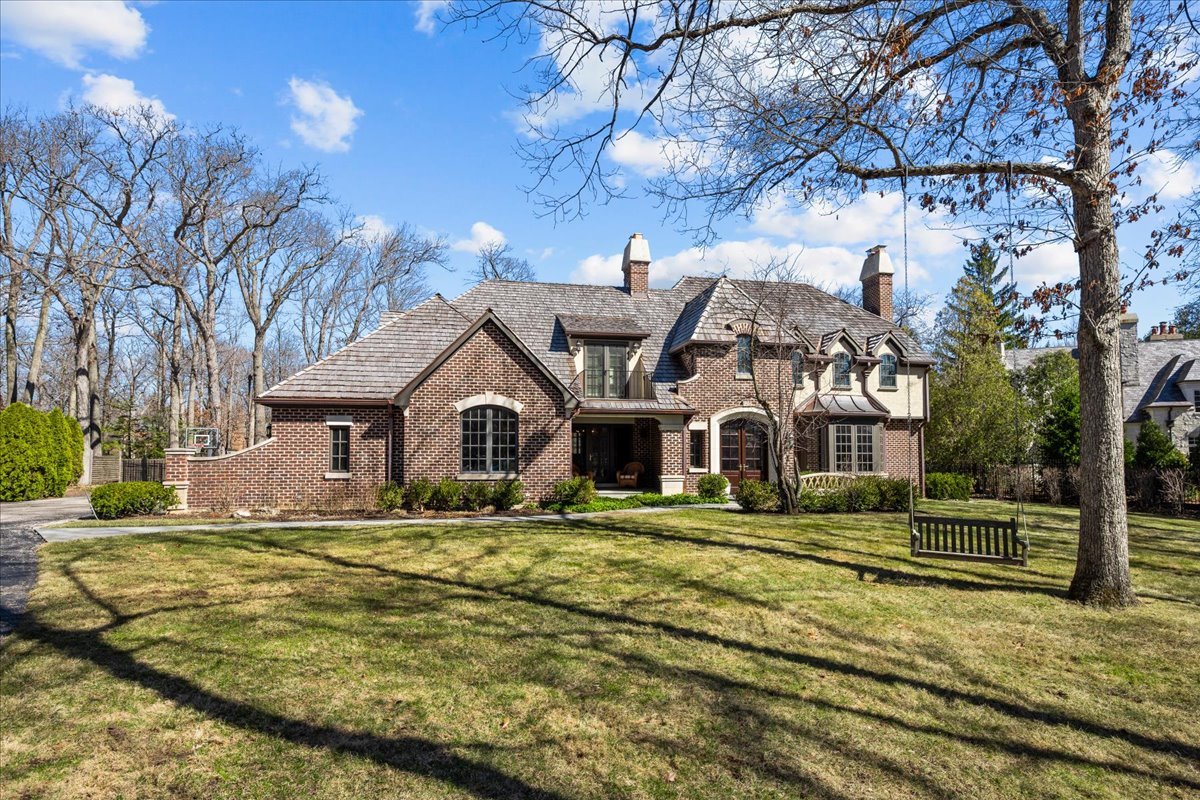 936 Ringwood Road Lake Forest, IL 60045 - Photo 1 of 58 a front view of a house with a yard