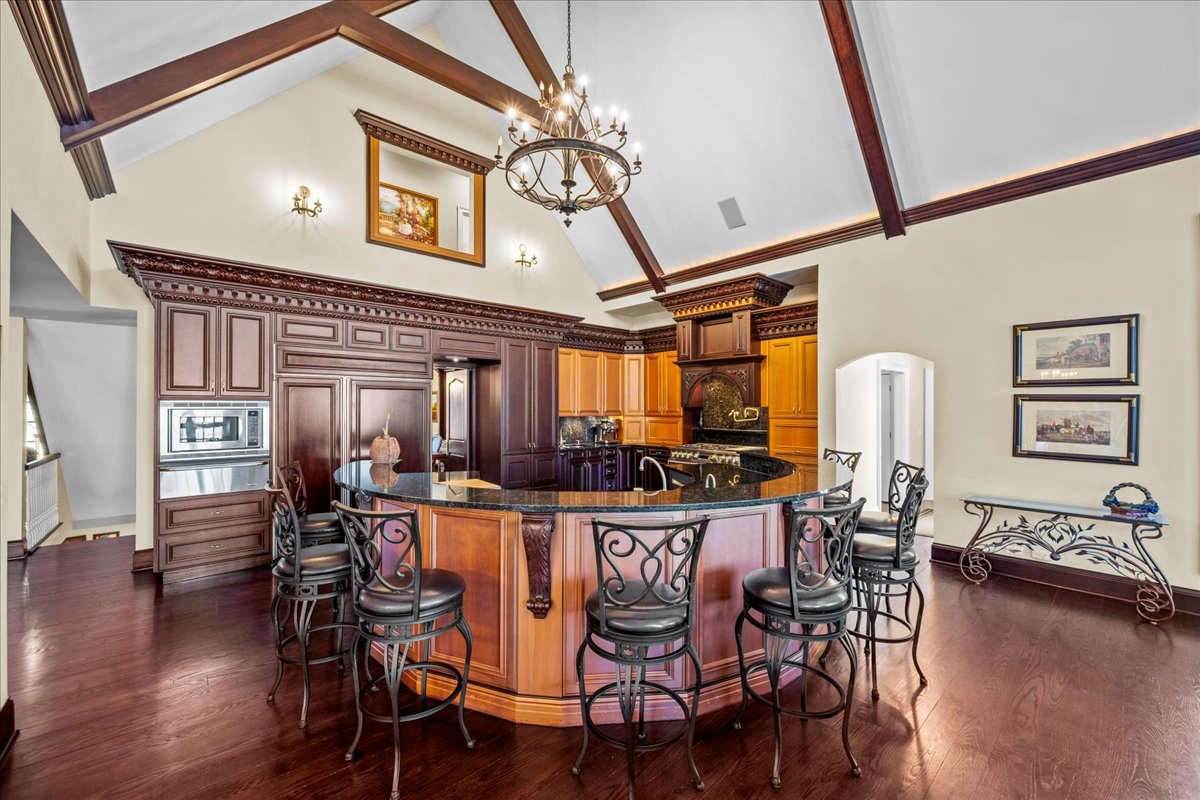 936 Ringwood Road Lake Forest, IL 60045 - Photo 22 of 58 a view of a dining room with furniture and wooden floor