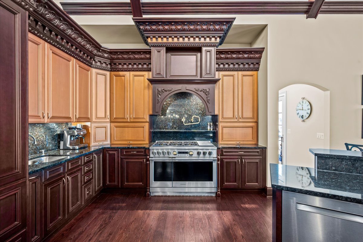 936 Ringwood Road Lake Forest, IL 60045 - Photo 26 of 58 a kitchen with stainless steel appliances granite countertop a stove and a refrigerator