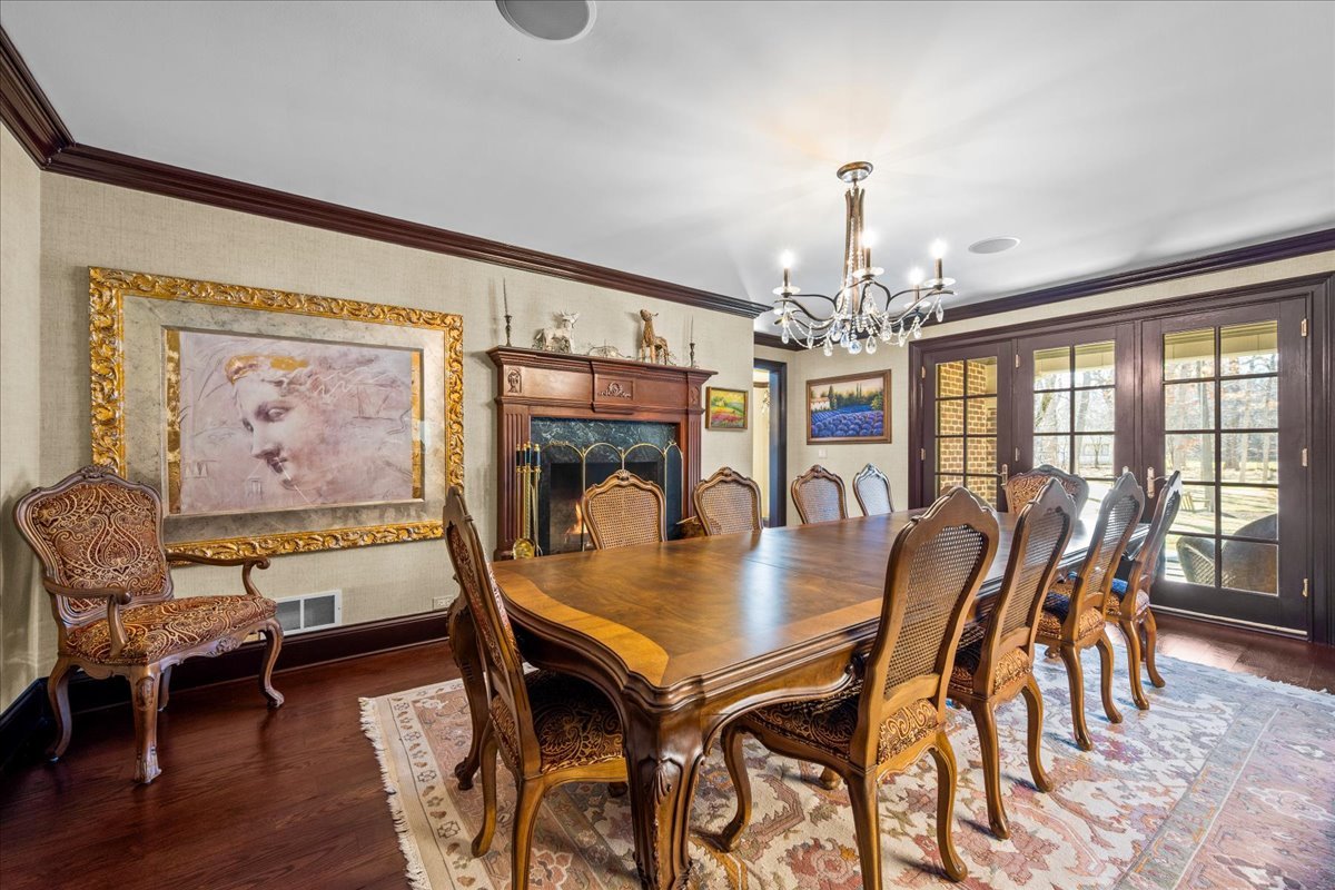 936 Ringwood Road Lake Forest, IL 60045 - Photo 27 of 58 a view of a dining room with furniture window and wooden floor