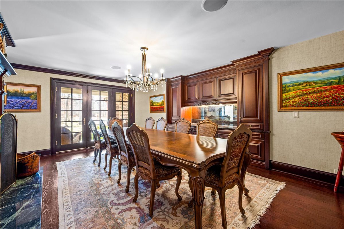 936 Ringwood Road Lake Forest, IL 60045 - Photo 28 of 58 a view of a dining room with furniture window and wooden floor