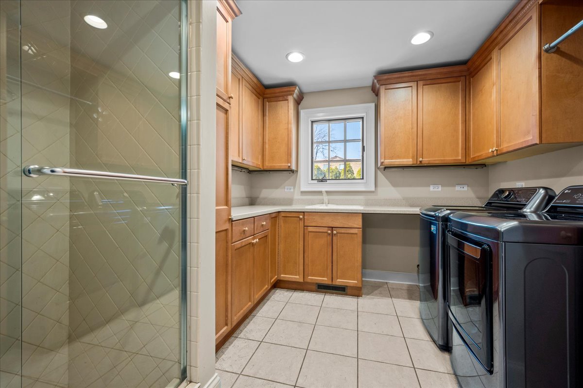 936 Ringwood Road Lake Forest, IL 60045 - Photo 31 of 58 a kitchen with a sink a counter top space and cabinets