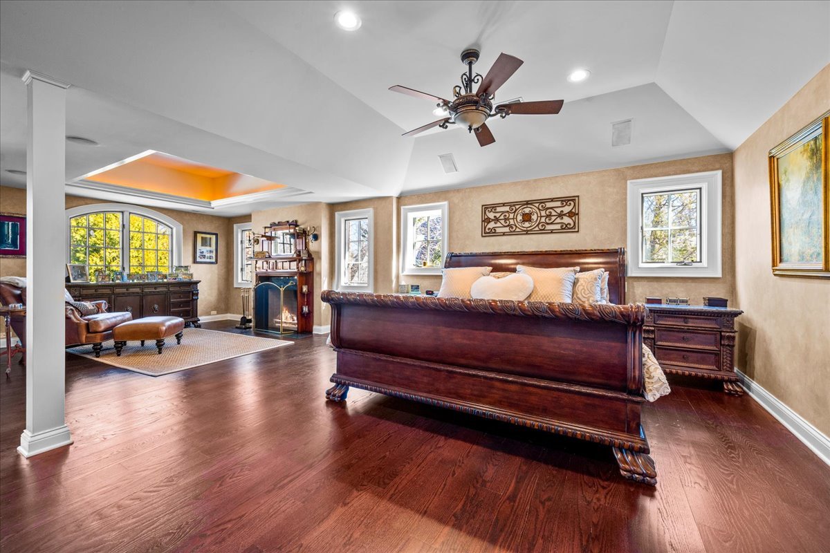 936 Ringwood Road Lake Forest, IL 60045 - Photo 32 of 58 a bedroom with a bed and wooden floor