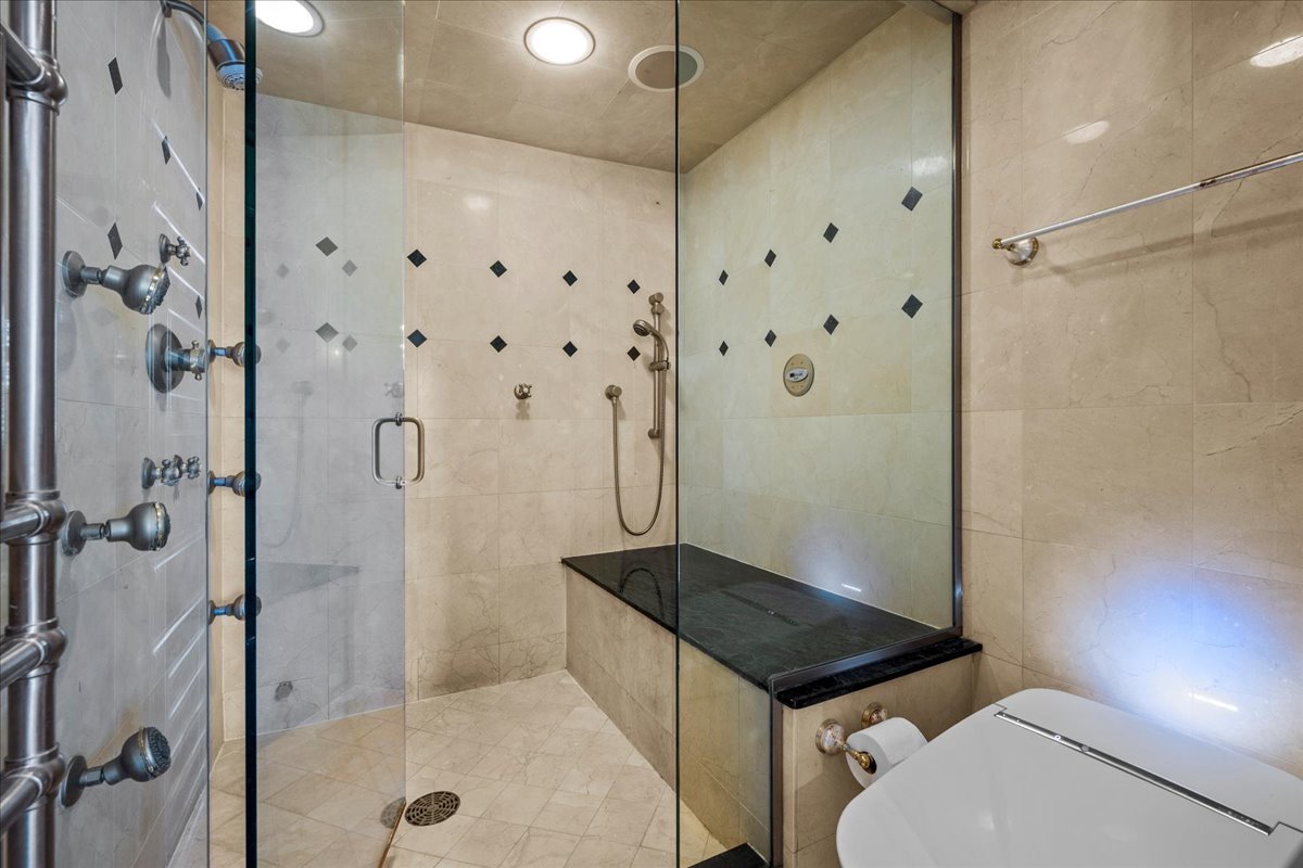 936 Ringwood Road Lake Forest, IL 60045 - Photo 35 of 58 a bathroom with a granite countertop shower a toilet and a sink
