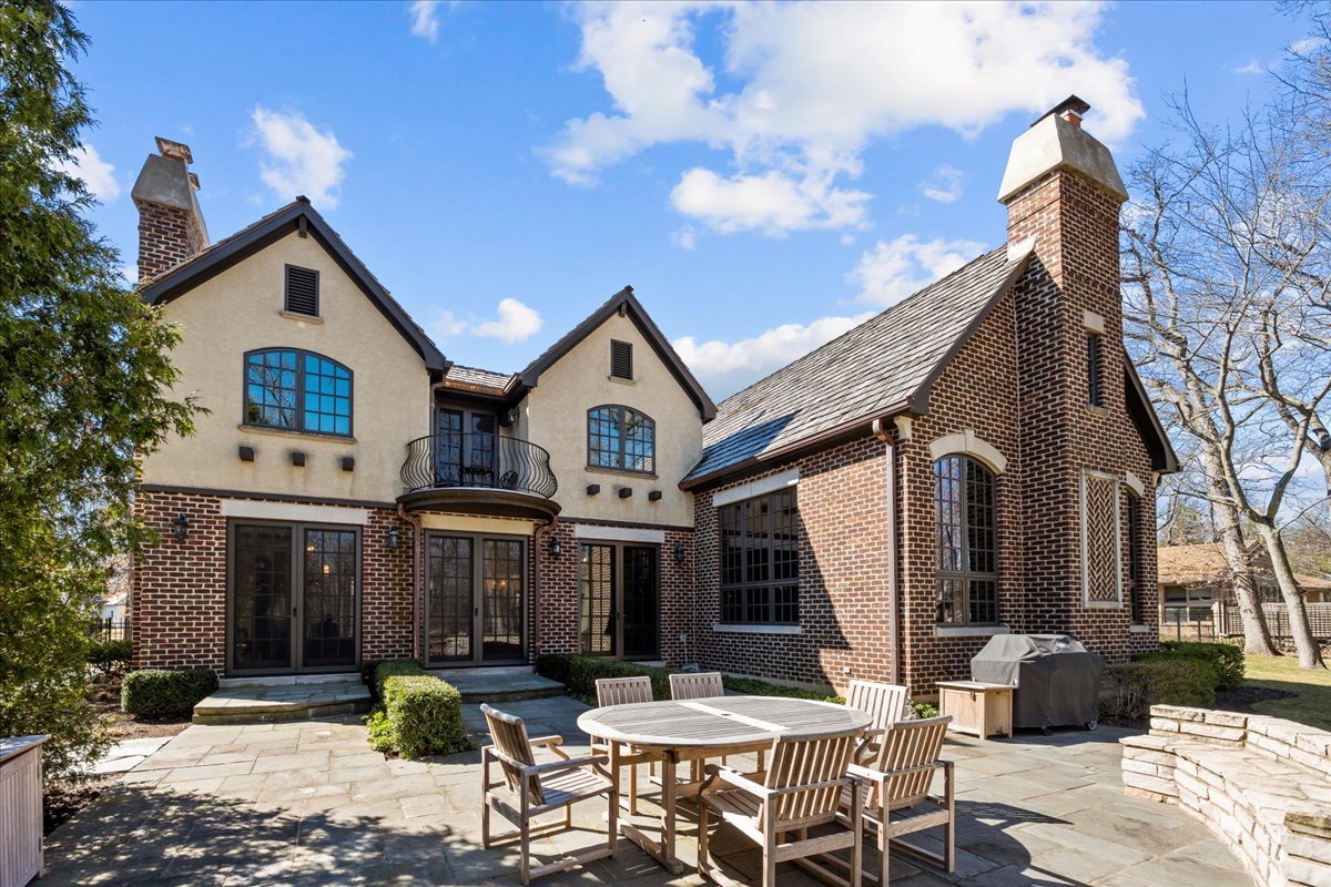 936 Ringwood Road Lake Forest, IL 60045 - Photo 50 of 58 a front view of a house with patio