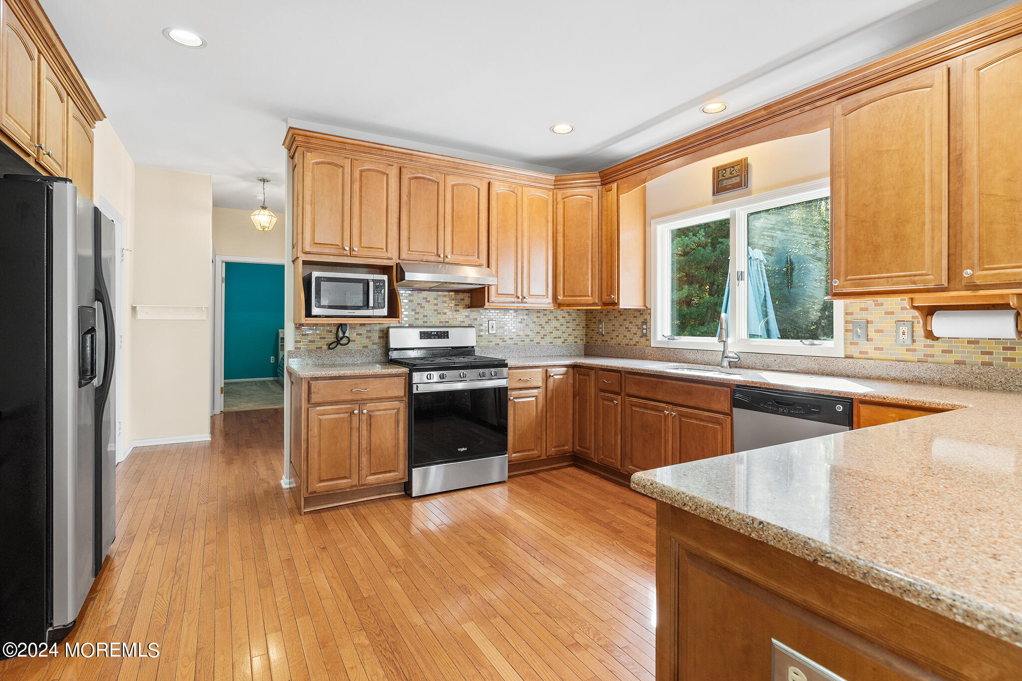276 Nottingham Road Morganville, NJ 07751 - Photo 13 of 55 a kitchen with stainless steel appliances granite countertop a stove a sink and a refrigerator