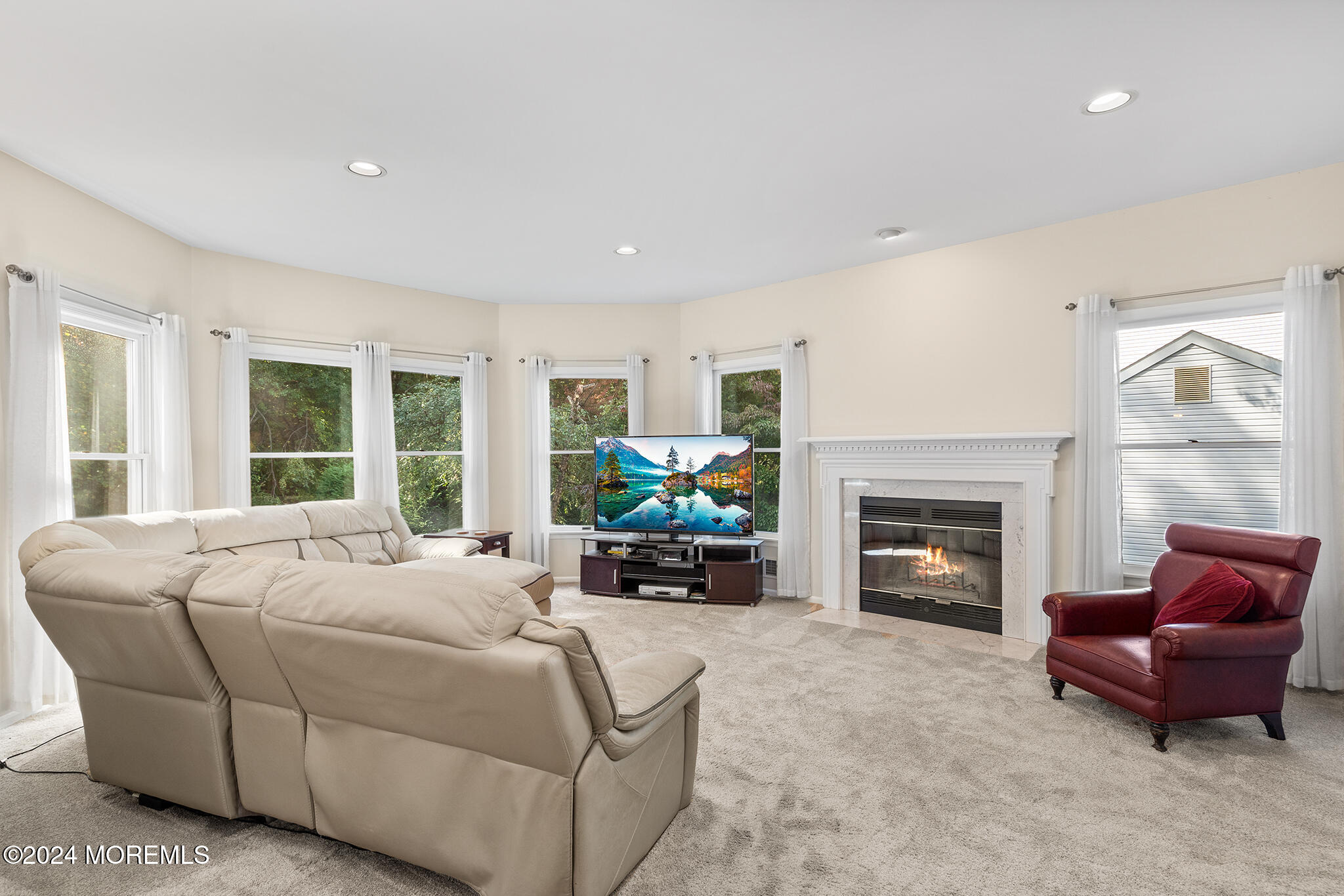 276 Nottingham Road Morganville, NJ 07751 - Photo 16 of 55 a bed room with furniture and a fireplace