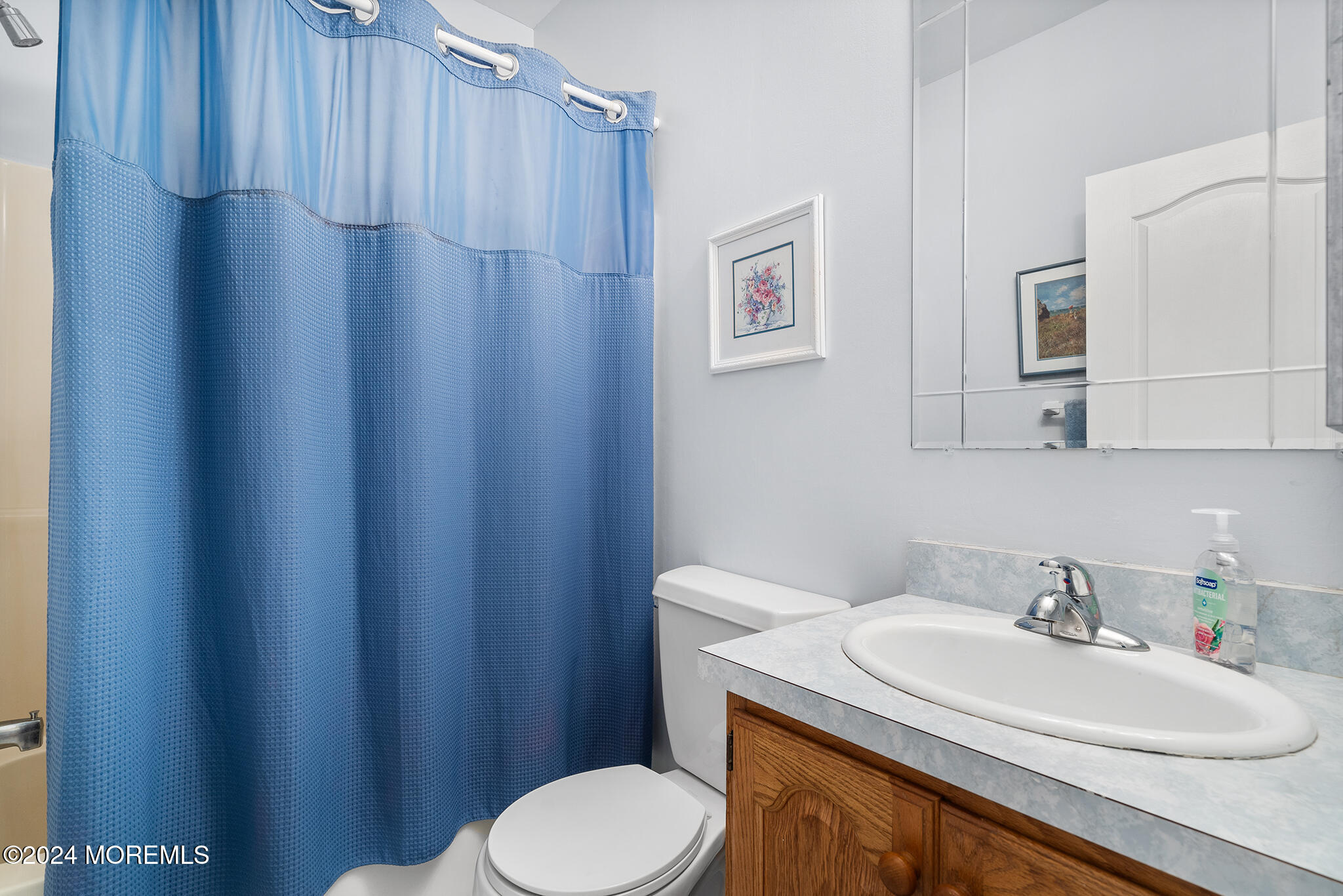 276 Nottingham Road Morganville, NJ 07751 - Photo 20 of 55 a bathroom with a sink a toilet and mirror