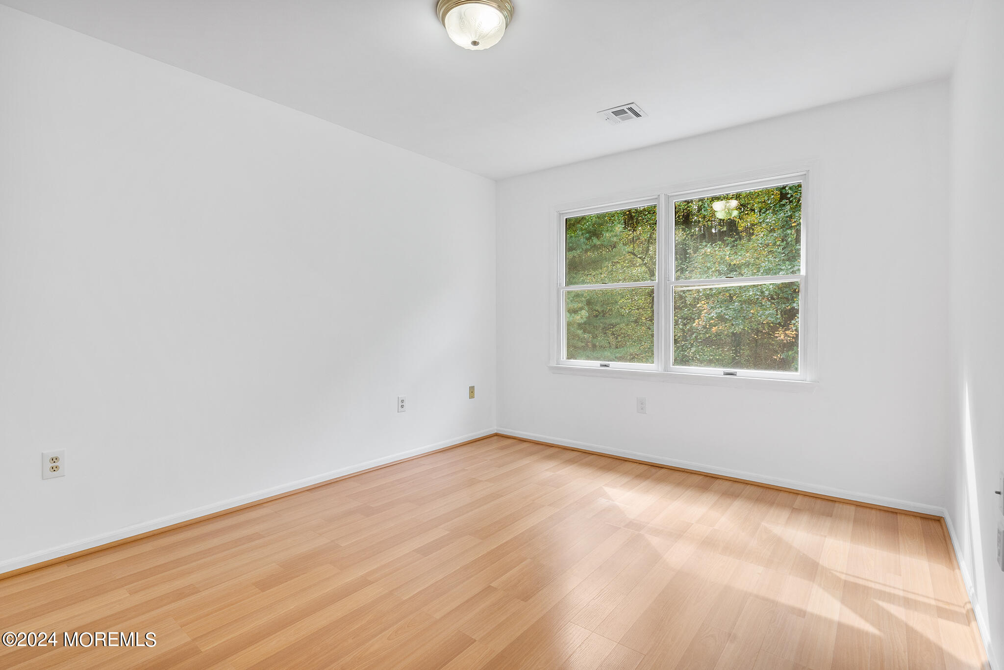 276 Nottingham Road Morganville, NJ 07751 - Photo 24 of 55 an empty room with a window