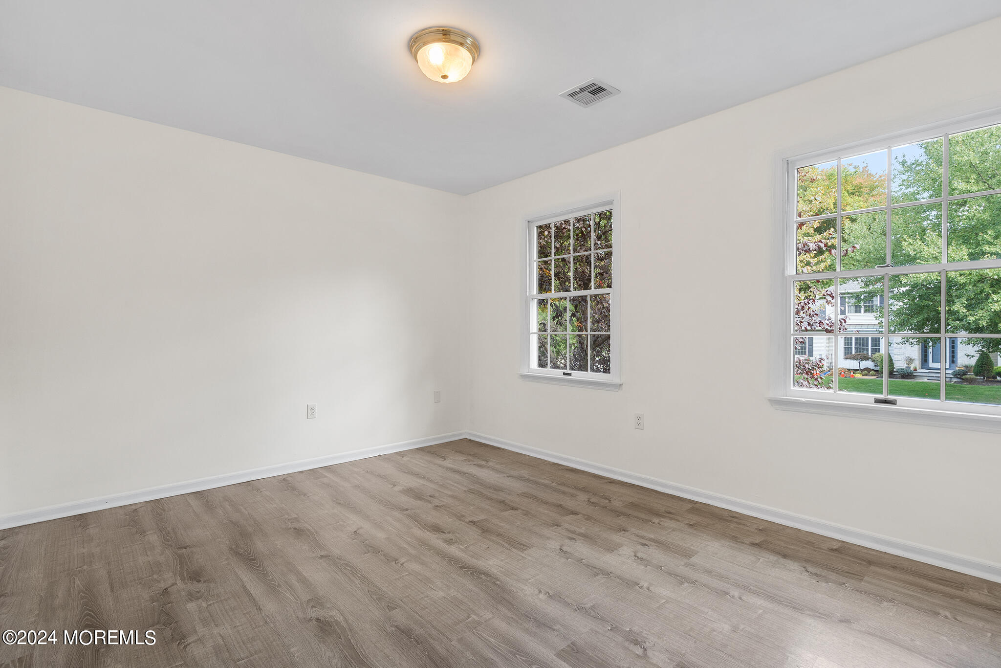 276 Nottingham Road Morganville, NJ 07751 - Photo 31 of 55 an empty room with windows