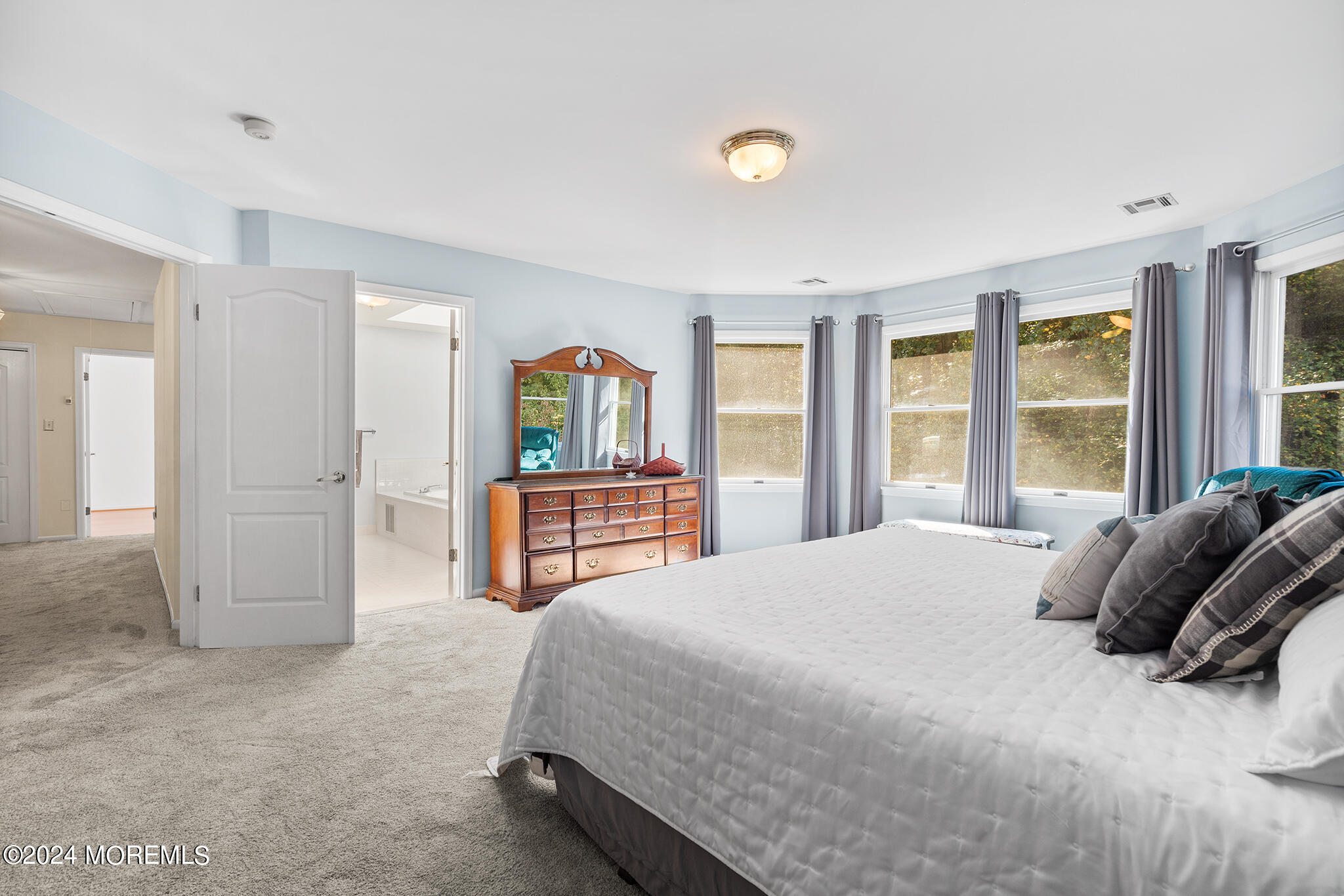 276 Nottingham Road Morganville, NJ 07751 - Photo 35 of 55 a bedroom with a bed and large windows