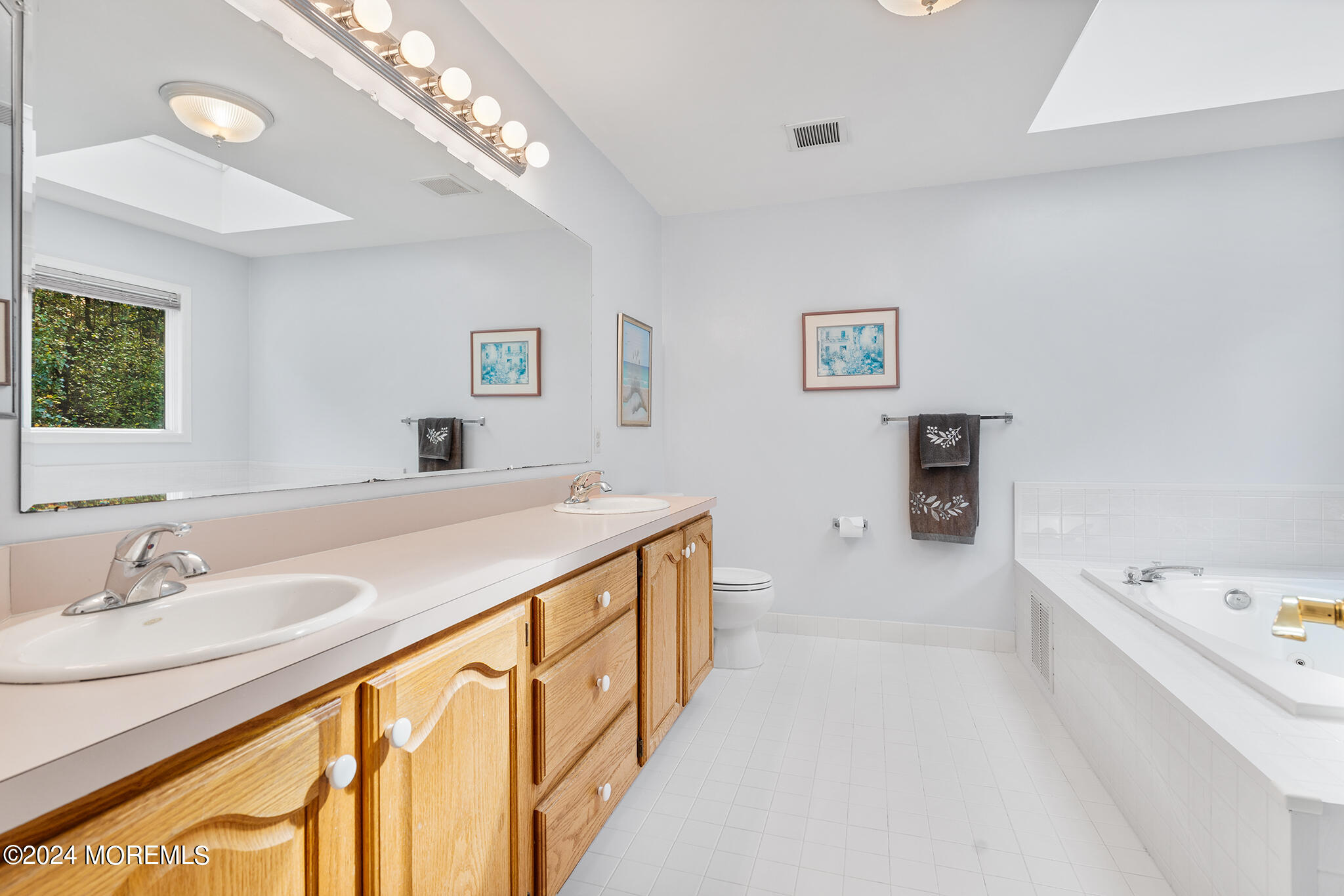 276 Nottingham Road Morganville, NJ 07751 - Photo 37 of 55 a spacious bathroom with a bathtub and a sink