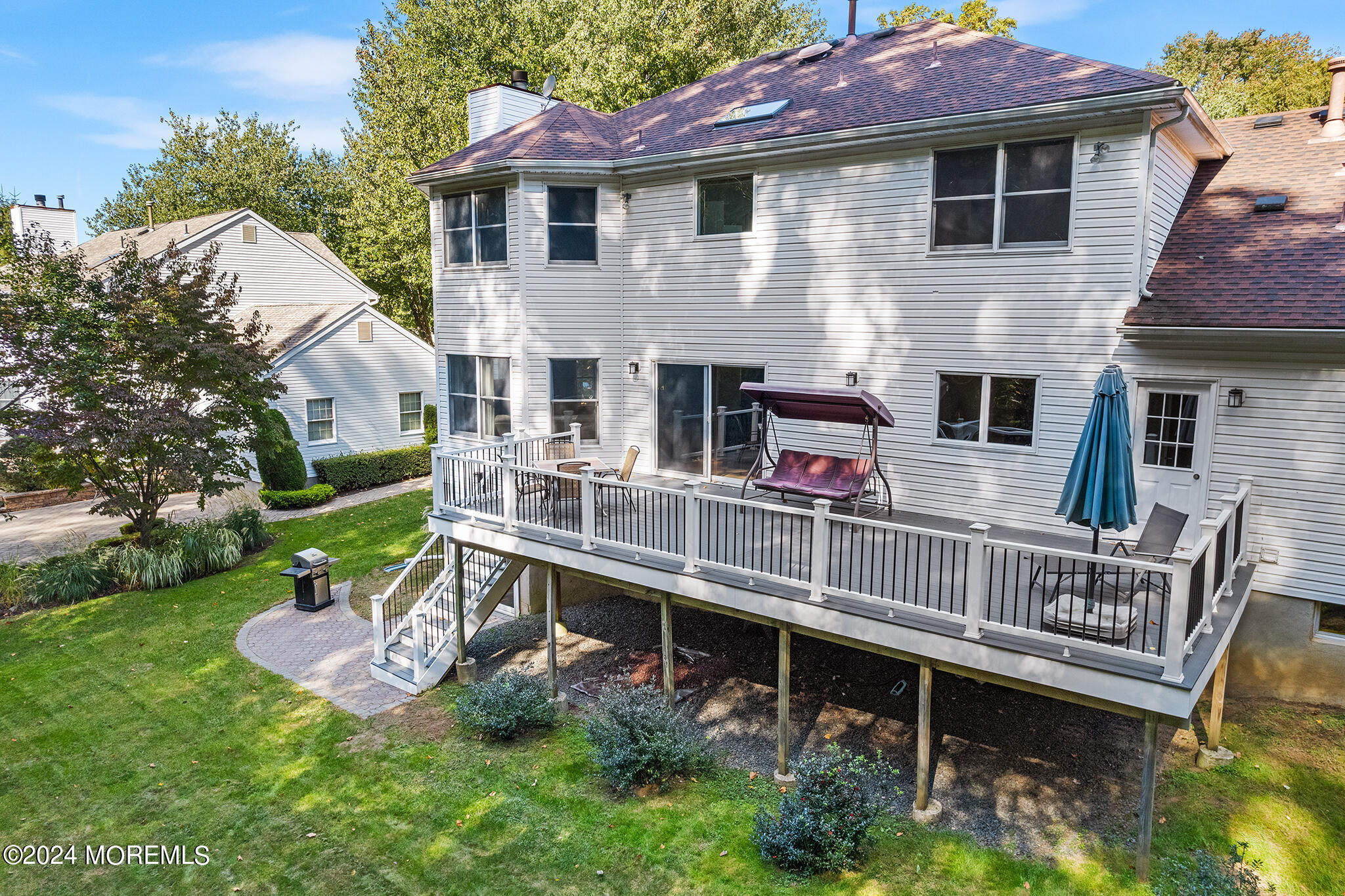 276 Nottingham Road Morganville, NJ 07751 - Photo 47 of 55 a view of house with a chairs in a patio
