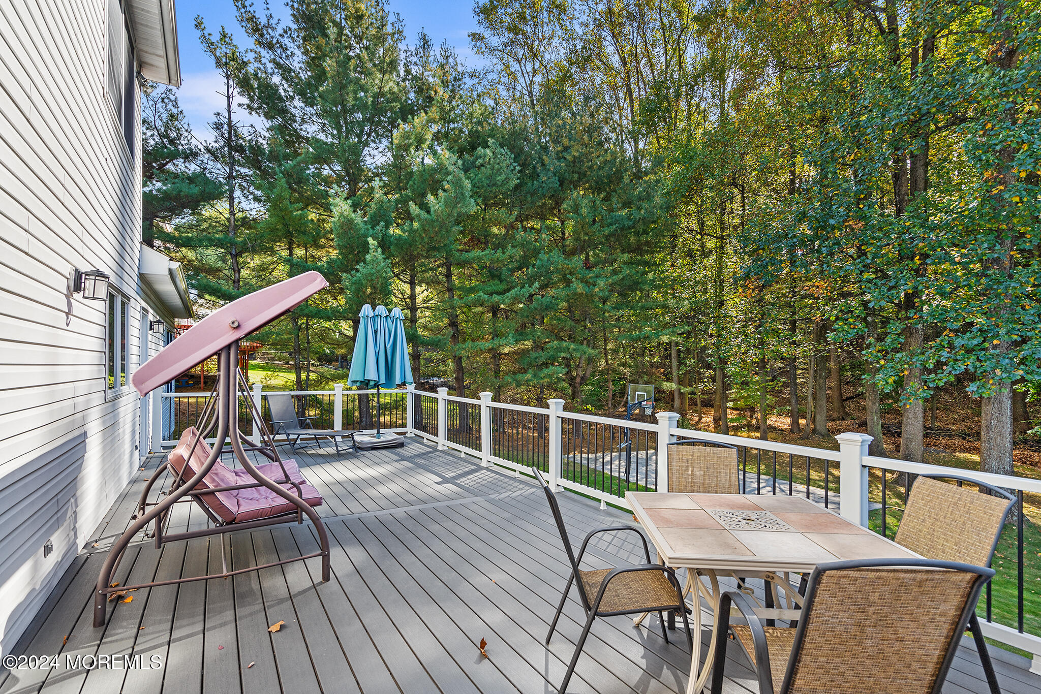 276 Nottingham Road Morganville, NJ 07751 - Photo 48 of 55 a view of a chairs and table on the deck