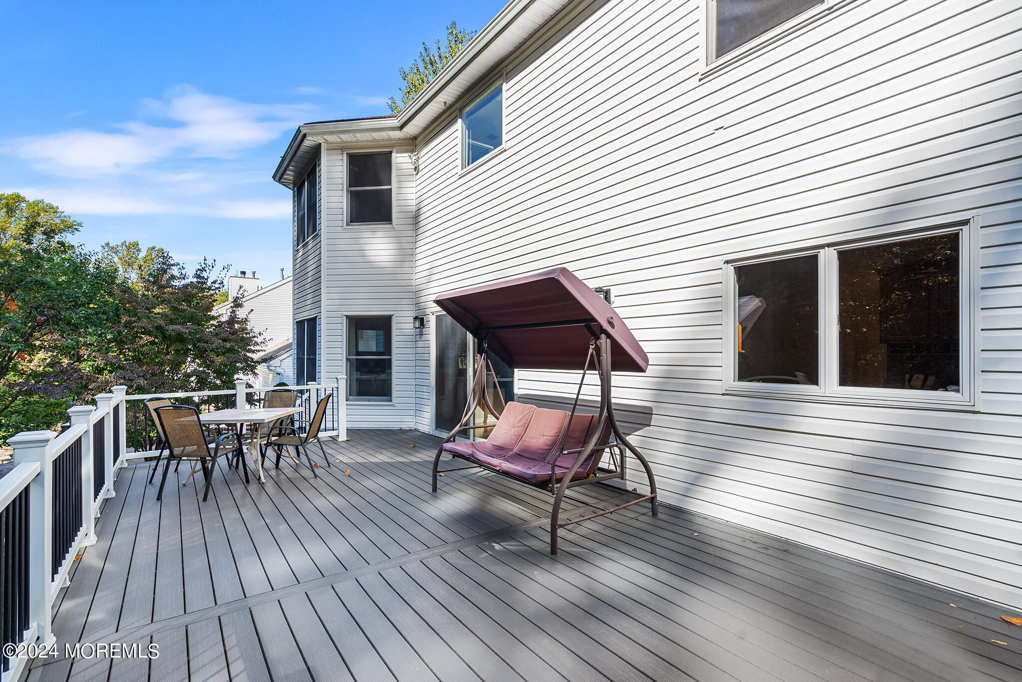 276 Nottingham Road Morganville, NJ 07751 - Photo 49 of 55 a chair and table on wooden deck