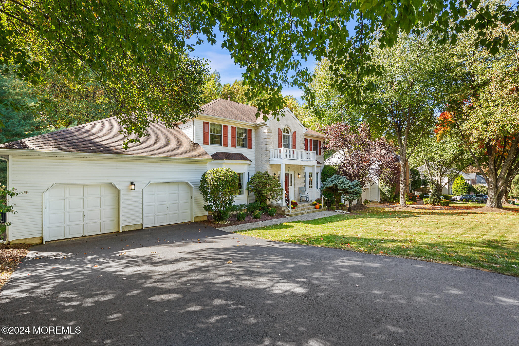 276 Nottingham Road Morganville, NJ 07751 - Photo 50 of 55 a front view of a house with a yard and garage