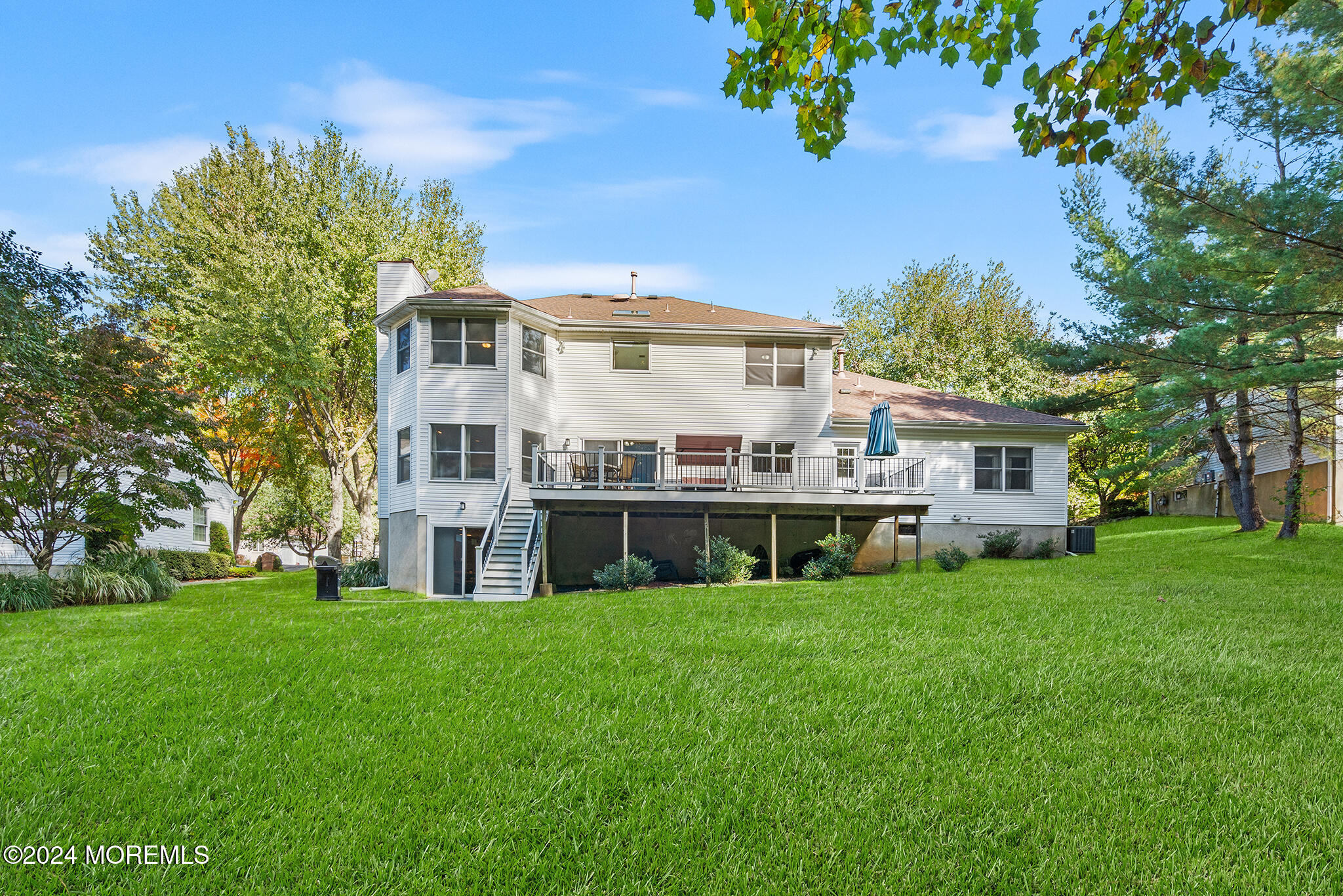 276 Nottingham Road Morganville, NJ 07751 - Photo 51 of 55 a view of a house with a big yard and large trees