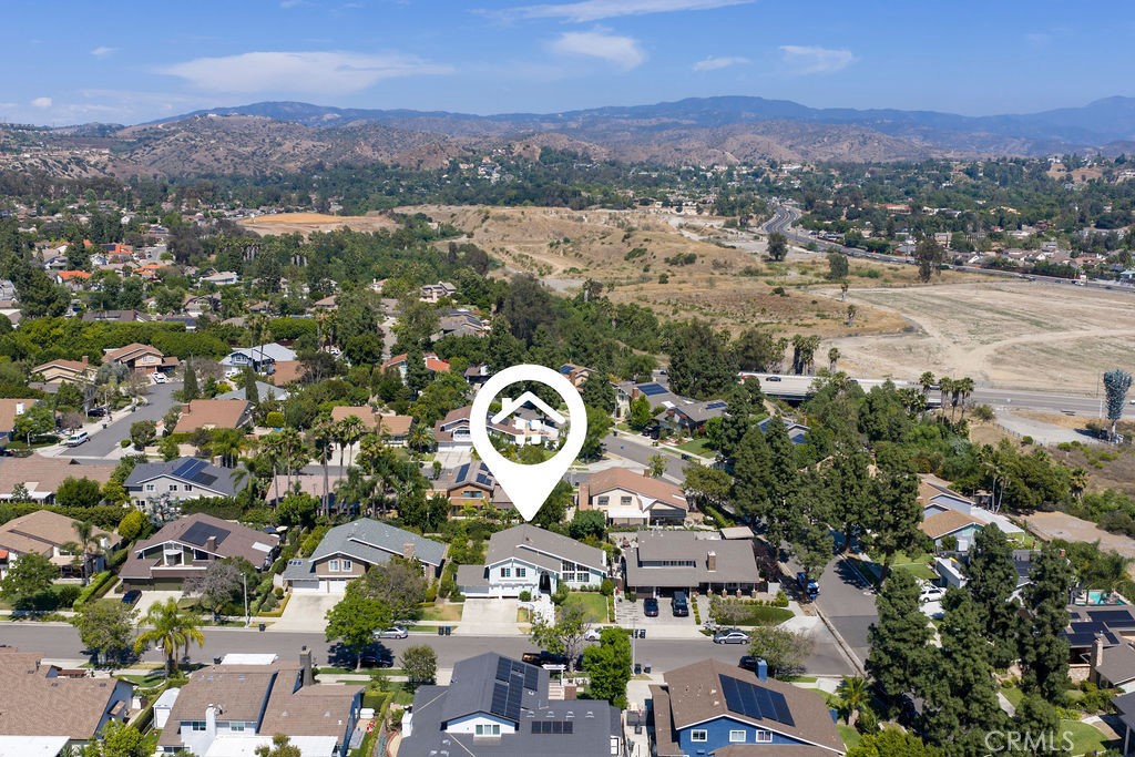 1663 North Yurok Street Orange, CA 92867 - Photo 24 of 31 an aerial view of a city with lots of residential buildings