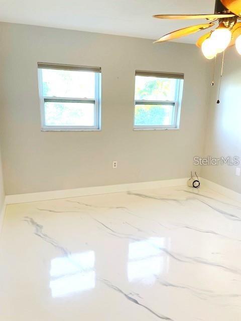1 Boca Ciega Point Boulevard, Unit 115 St. Petersburg, FL 33708 - Photo 17 of 35 a bathroom with a bathtub and a window