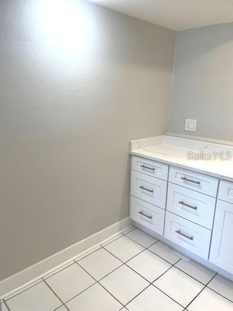 1 Boca Ciega Point Boulevard, Unit 115 St. Petersburg, FL 33708 - Photo 21 of 35 a room with a cabinets and a dresser