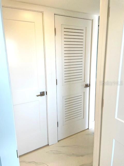 1 Boca Ciega Point Boulevard, Unit 115 St. Petersburg, FL 33708 - Photo 24 of 35 a view of a small space with racks on the wall