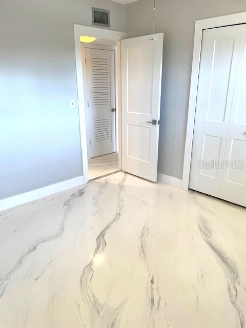 1 Boca Ciega Point Boulevard, Unit 115 St. Petersburg, FL 33708 - Photo 27 of 35 an empty room with a fireplace