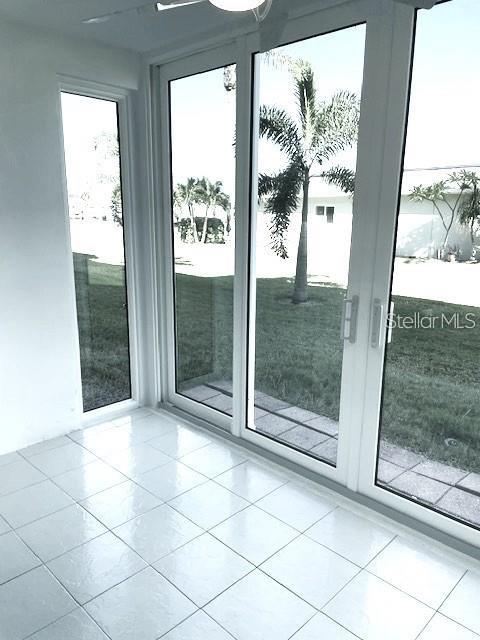 1 Boca Ciega Point Boulevard, Unit 115 St. Petersburg, FL 33708 - Photo 31 of 35 a view of a glass door and a front door