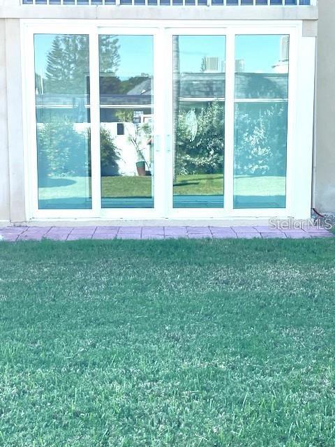 1 Boca Ciega Point Boulevard, Unit 115 St. Petersburg, FL 33708 - Photo 33 of 35 a view of a house with a yard from a window