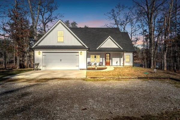 a view of yellow house with a outdoor space