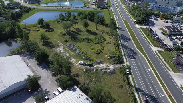 an aerial view of a residential houses with outdoor space