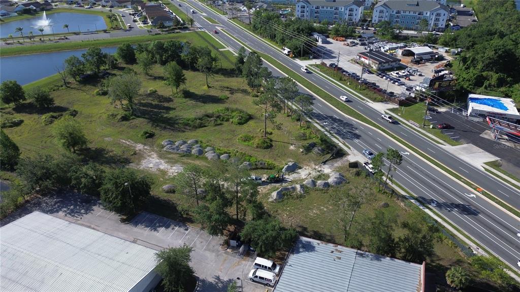 6347 Narcoossee Road Orlando, FL 32822 - Photo 2 of 17 an aerial view of a residential houses with outdoor space