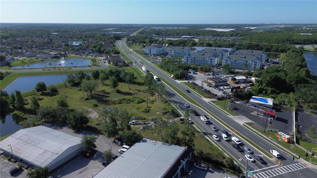 6347 Narcoossee Road Orlando, FL 32822 - Photo 3 of 17 an aerial view of a residential houses with outdoor space