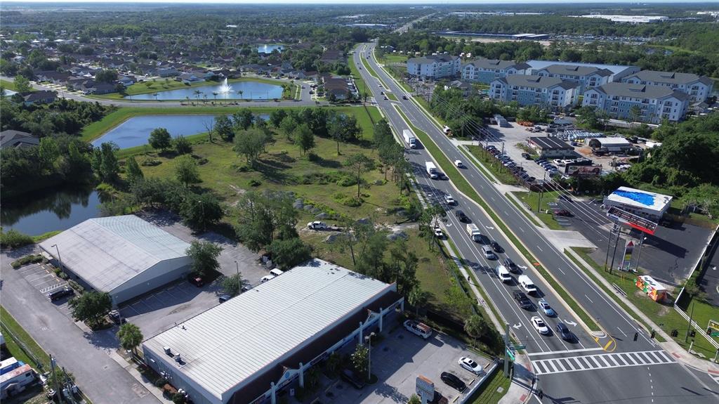6347 Narcoossee Road Orlando, FL 32822 - Photo 4 of 17 an aerial view of a city
