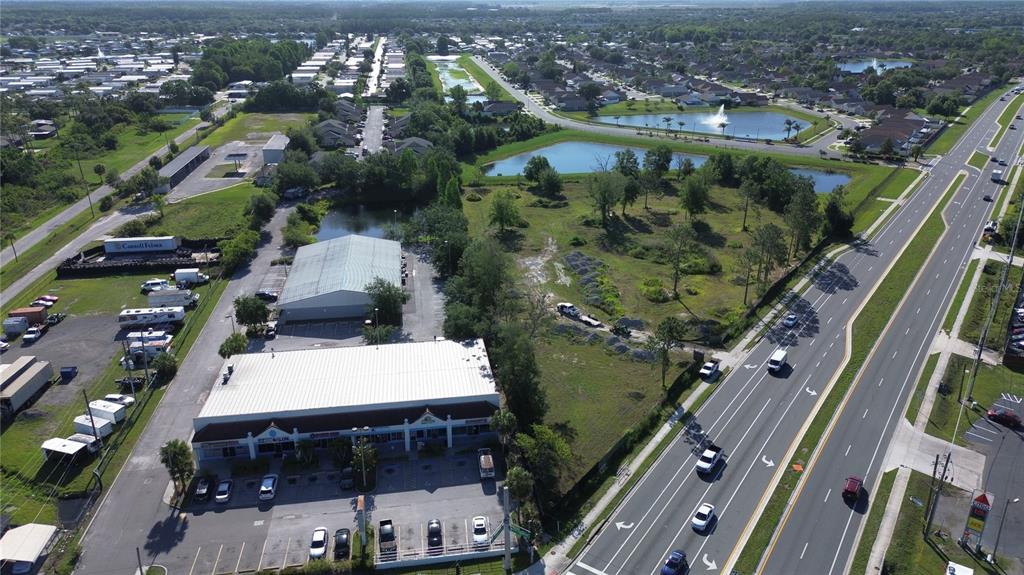 6347 Narcoossee Road Orlando, FL 32822 - Photo 6 of 17 an aerial view of residential houses with outdoor space