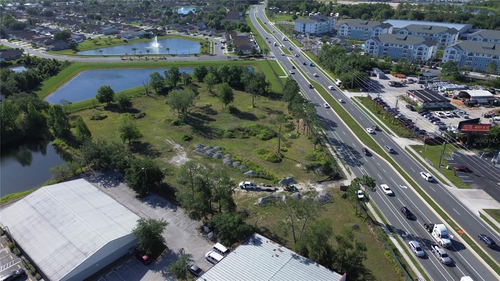 6347 Narcoossee Road Orlando, FL 32822 - Photo 7 of 17 an aerial view of a city