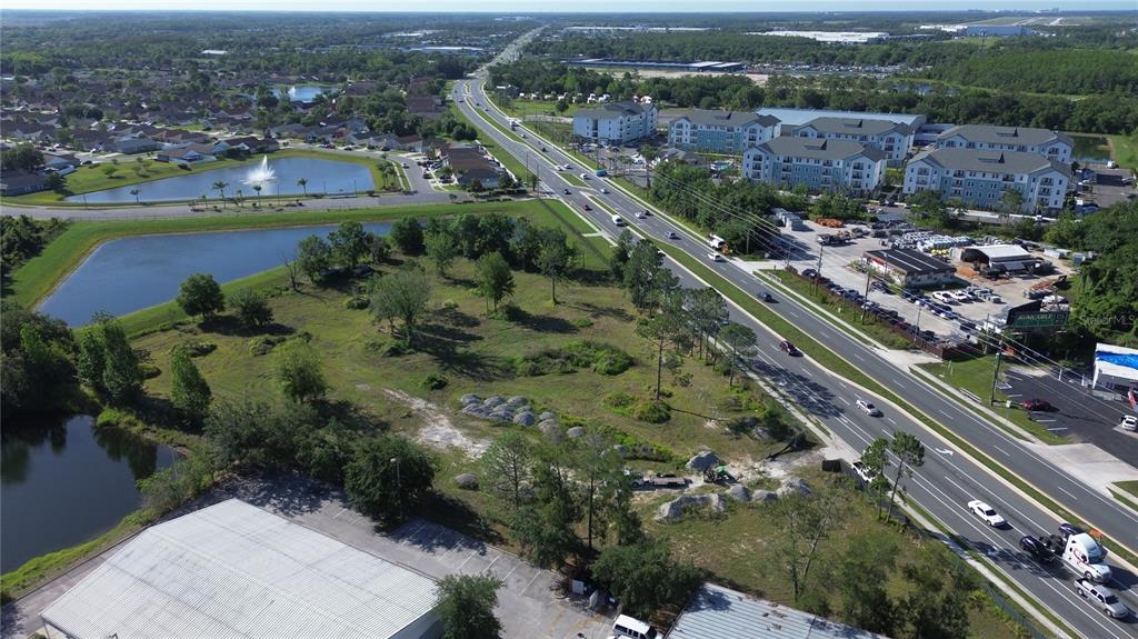 6347 Narcoossee Road Orlando, FL 32822 - Photo 8 of 17 an aerial view of residential houses with outdoor space and river