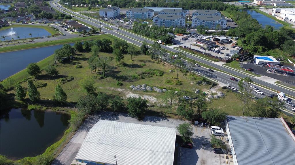 6347 Narcoossee Road Orlando, FL 32822 - Photo 9 of 17 an aerial view of a city