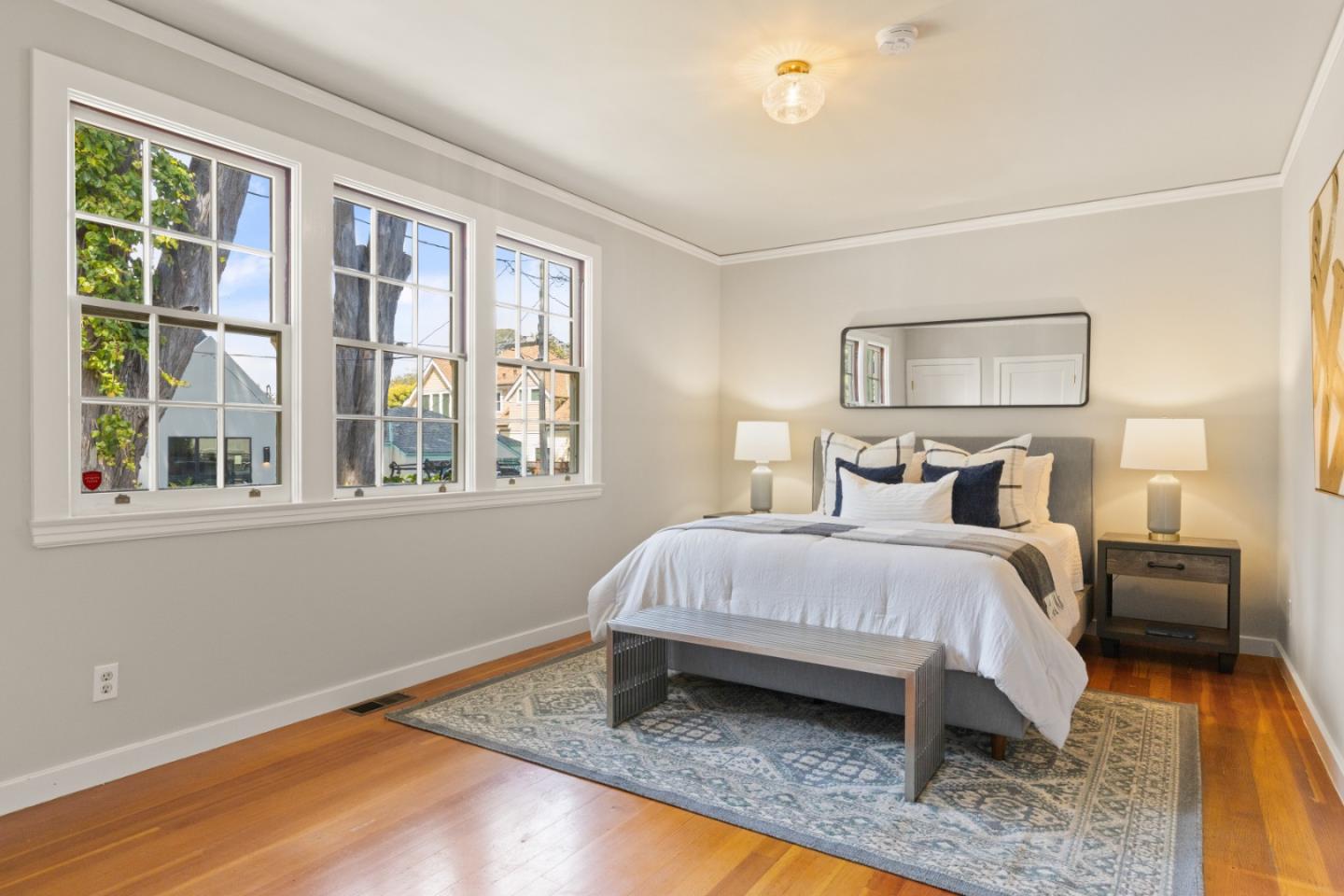223 Minerva Avenue Pacifica, CA 94044 - Photo 26 of 48 a spacious bedroom with a bed and wooden floor