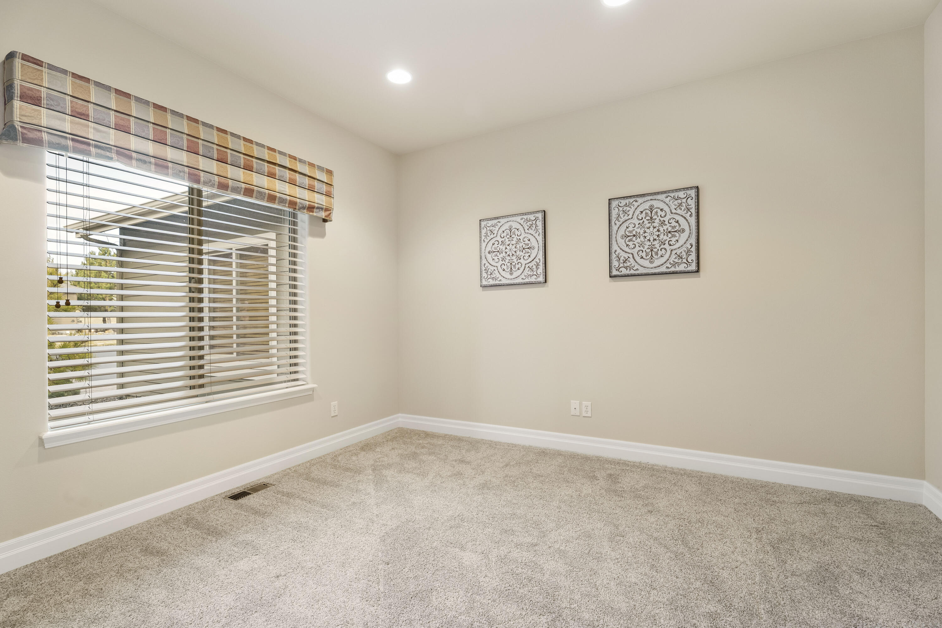 784 Ribbon Falls Road Redmond, OR 97756 - Photo 11 of 79 a view of an empty room with a window