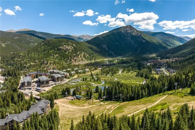 a view of a swimming pool with a yard