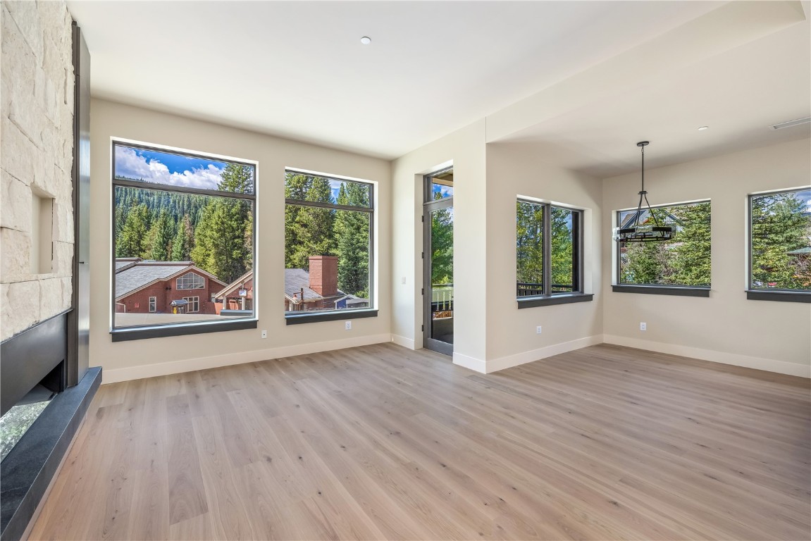 75 Hunki Dori Court, Unit W113 Keystone, CO 80435 - Photo 2 of 50 a view of an empty room with wooden floor and a window