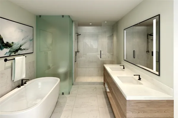 a bathroom with a tub a sink and mirror