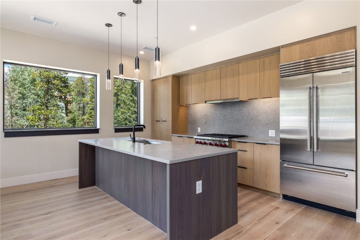 75 Hunki Dori Court, Unit W113 Keystone, CO 80435 - Photo 3 of 50 a kitchen with stainless steel appliances granite countertop a sink a stove and a refrigerator
