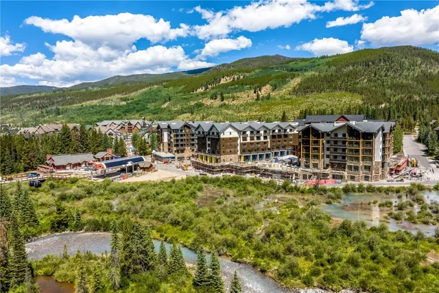 a view of a street that has couple of cars parked on the road